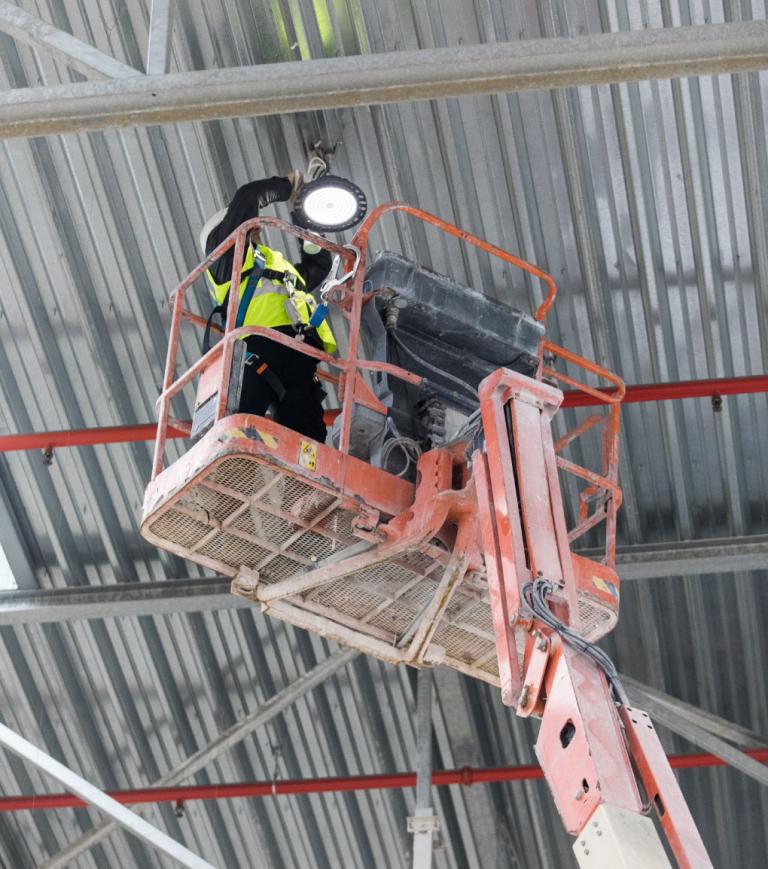 Technician working on a elevated structure