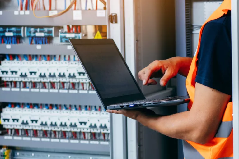 Technician checking consumption of an pannel