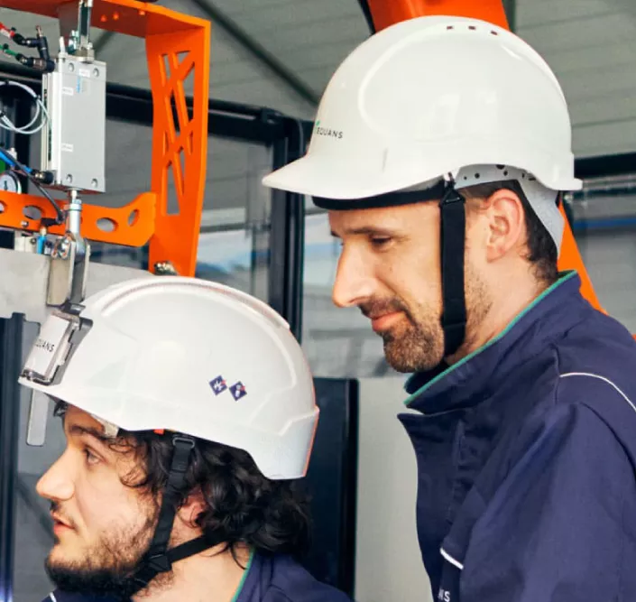 Two equans men working on a site