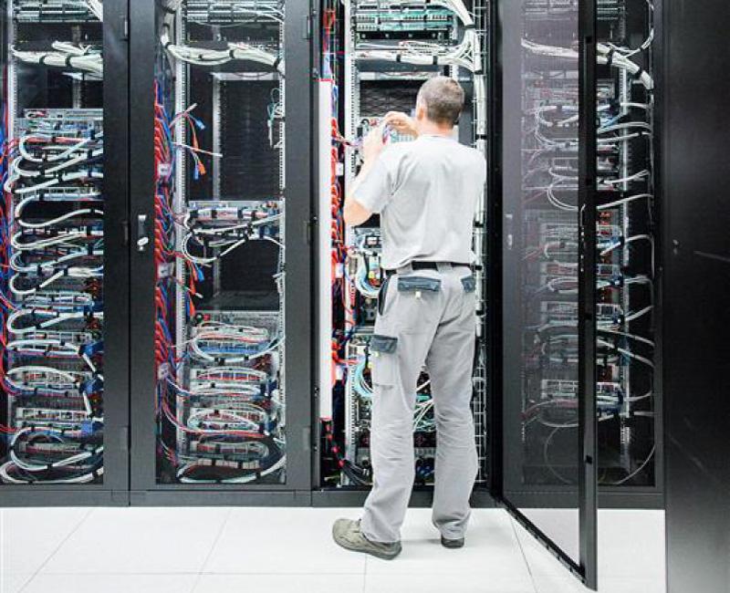 data center technician working on cabling