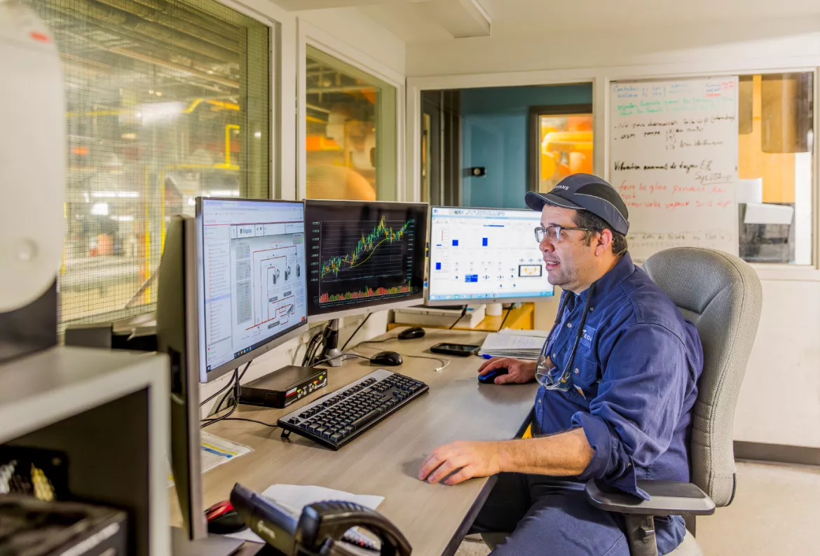 Equans technician working on a computer