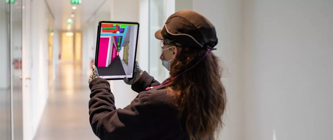 Equans woman employee using Simulation tool for IoT
