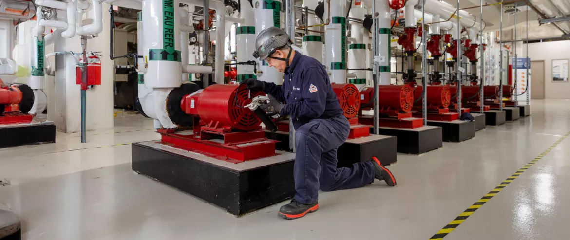 Equans Collaborator Working on a equipment