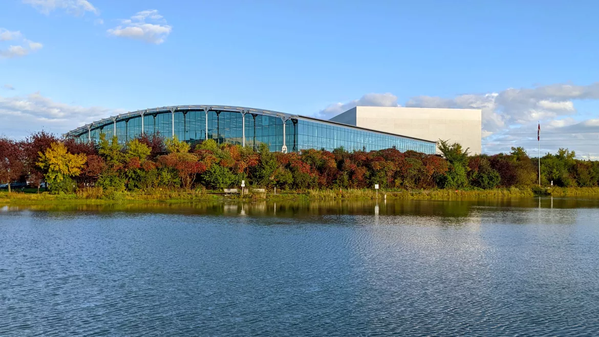 exterior shot of a building beside a body of water