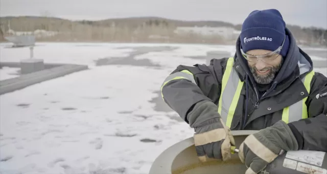 Automation technician working in the snow