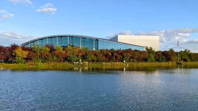 exterior shot of a building beside a body of water