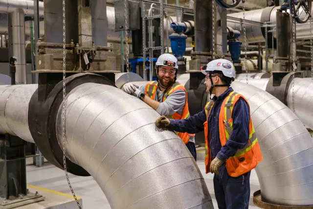 Pipes on the District Heating and Cooling and technical people