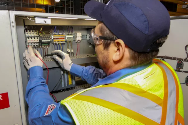 Mobile team with a man checking eletrical wares