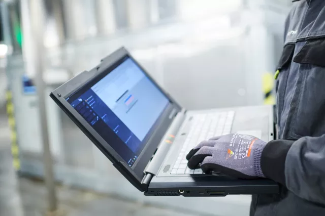 Man checlking maintenance through digital tools